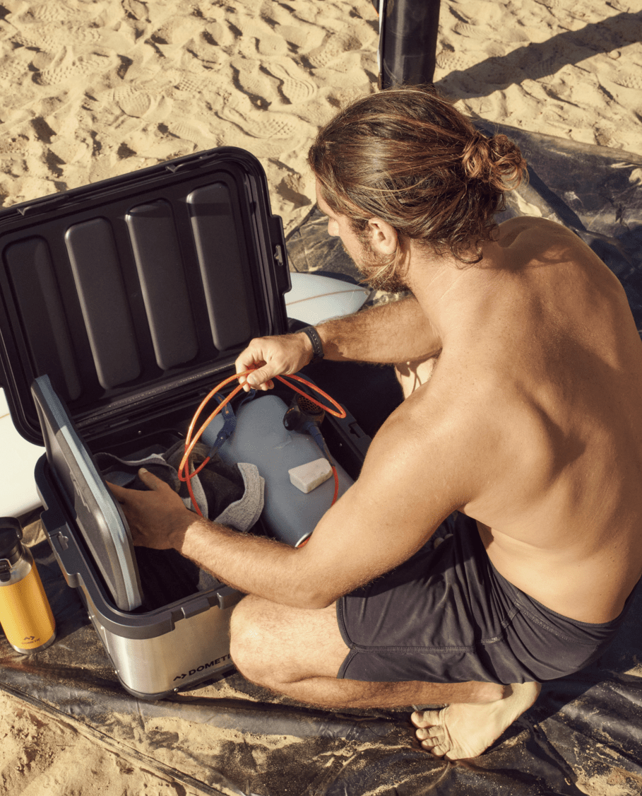 man using dometic go hard storage 50l