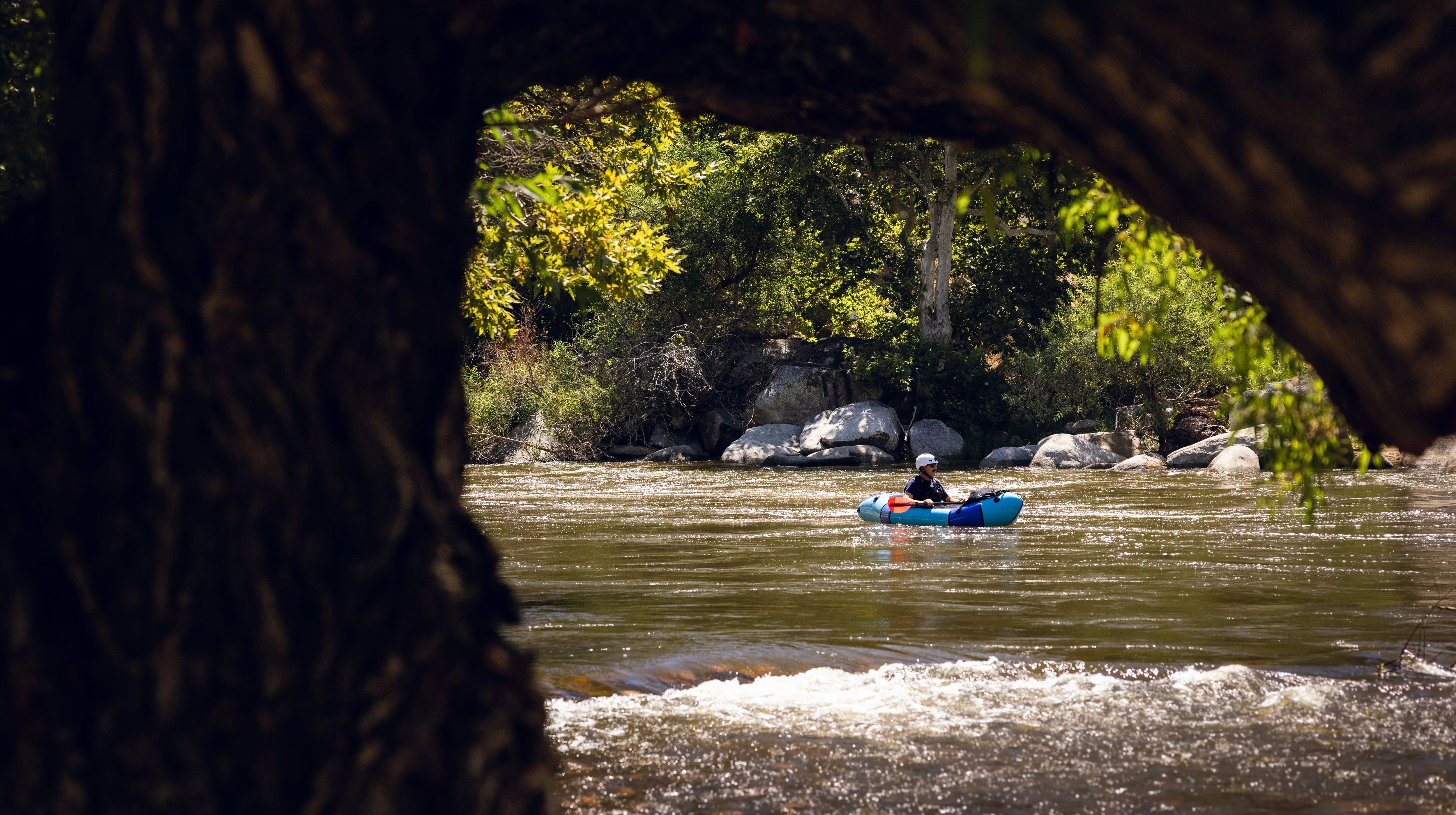 man paddling on river
