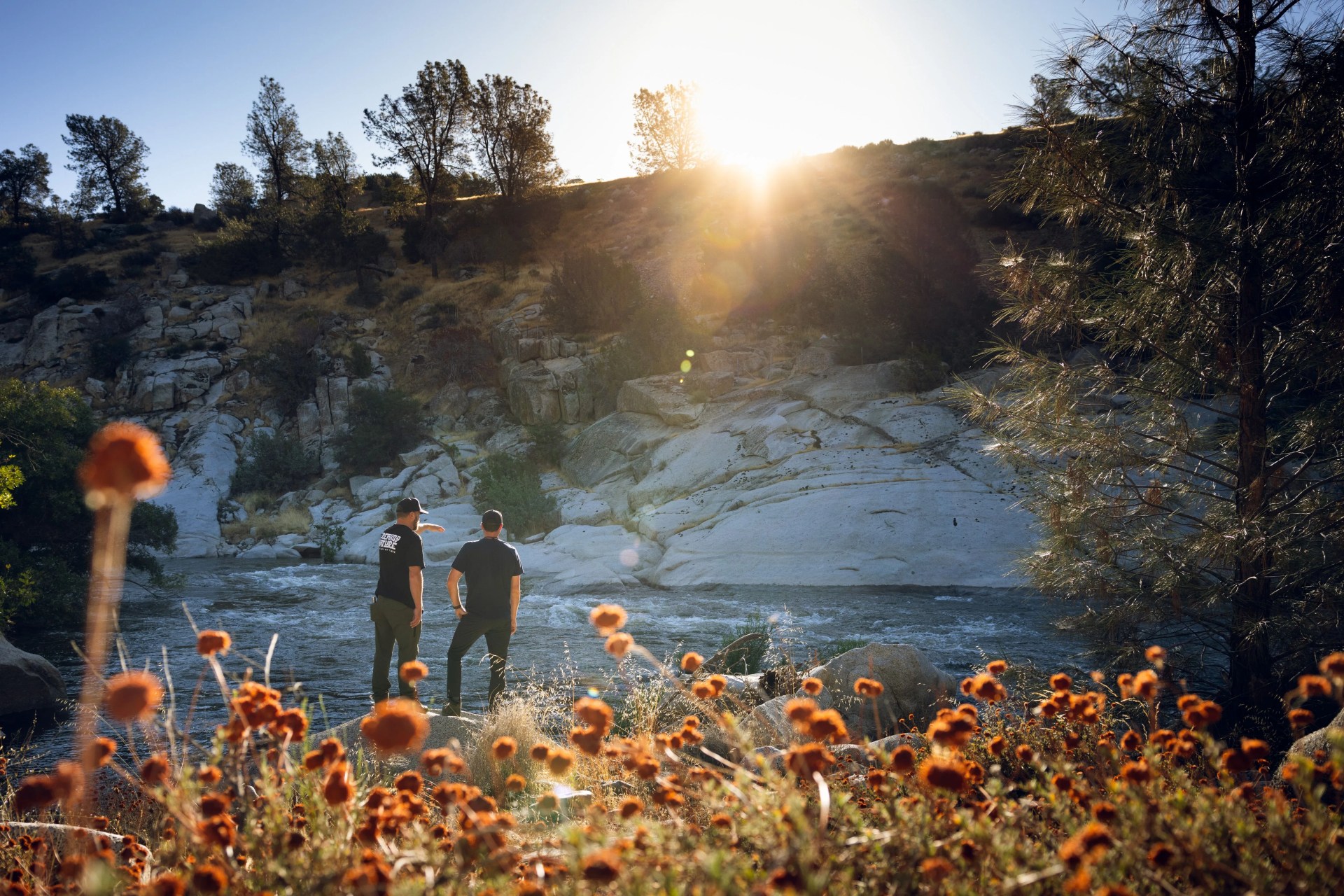two men standing by cliff