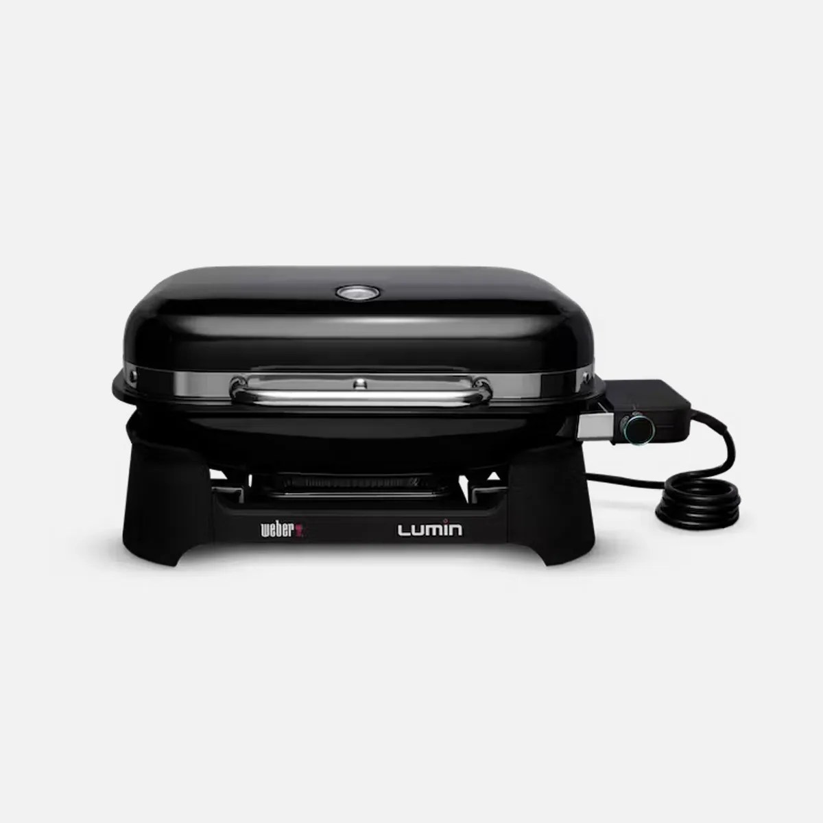 Black Weber Lumin grill closed on a light grey background