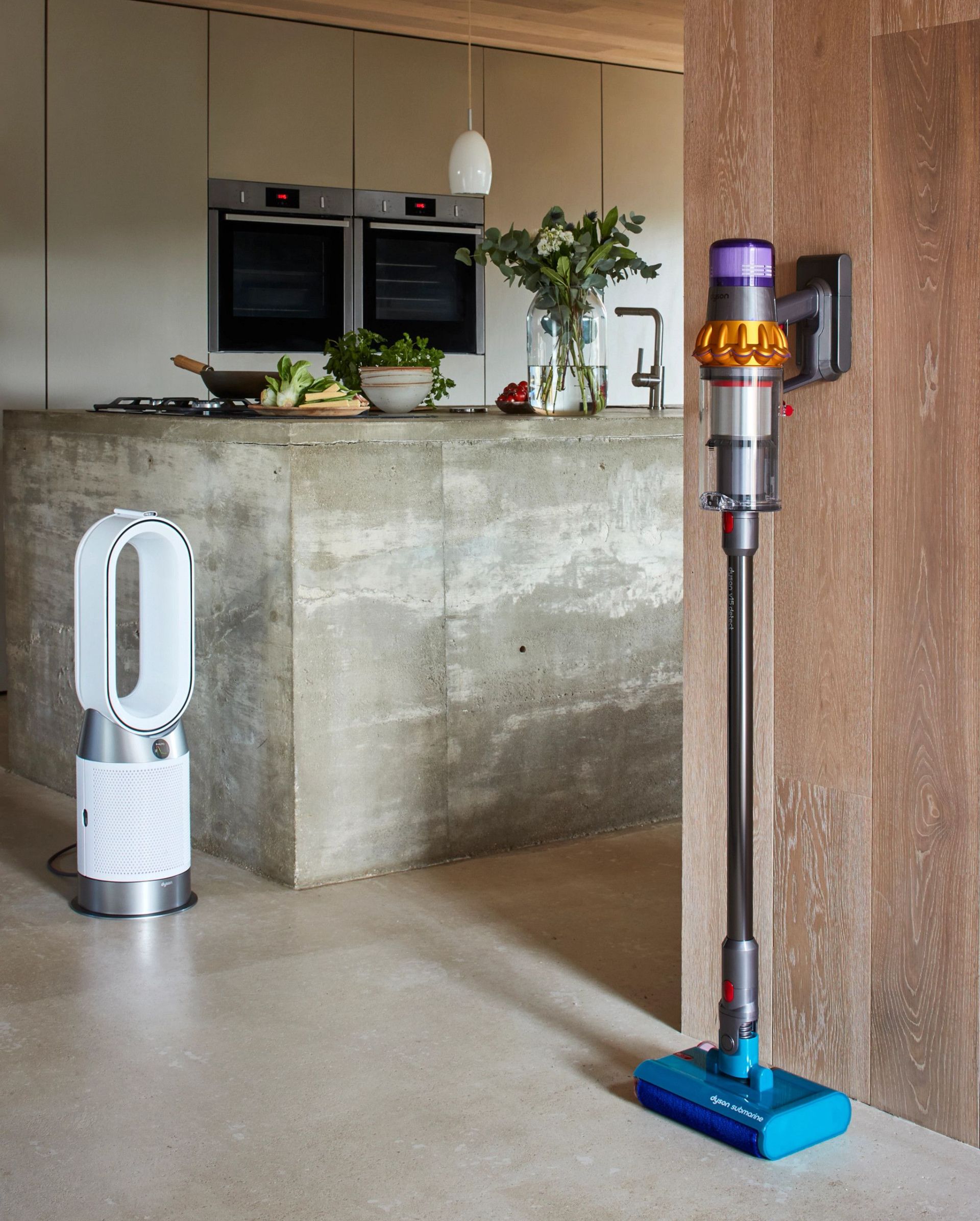 dyson vacuum leaning against the wall