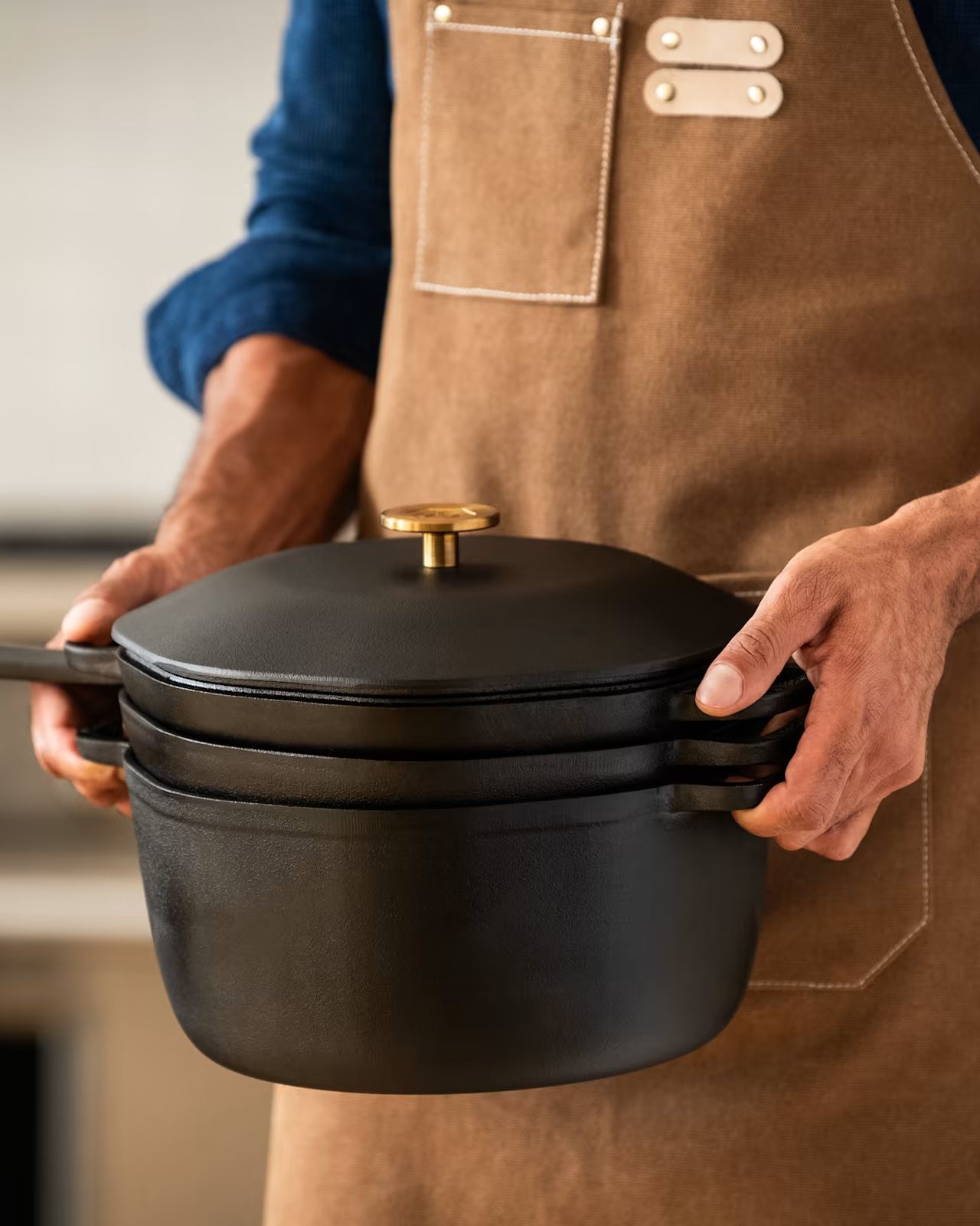 man holding marcellin 4 in 1 cast iron stack