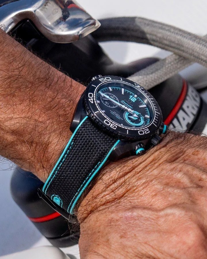 omega planet ocean 600m co axial master chronometer chronograph worn on man's wrist