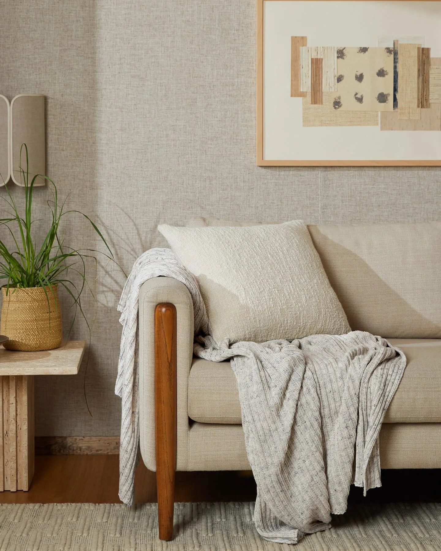 parachute oversized rib knit throw draped on side of couch