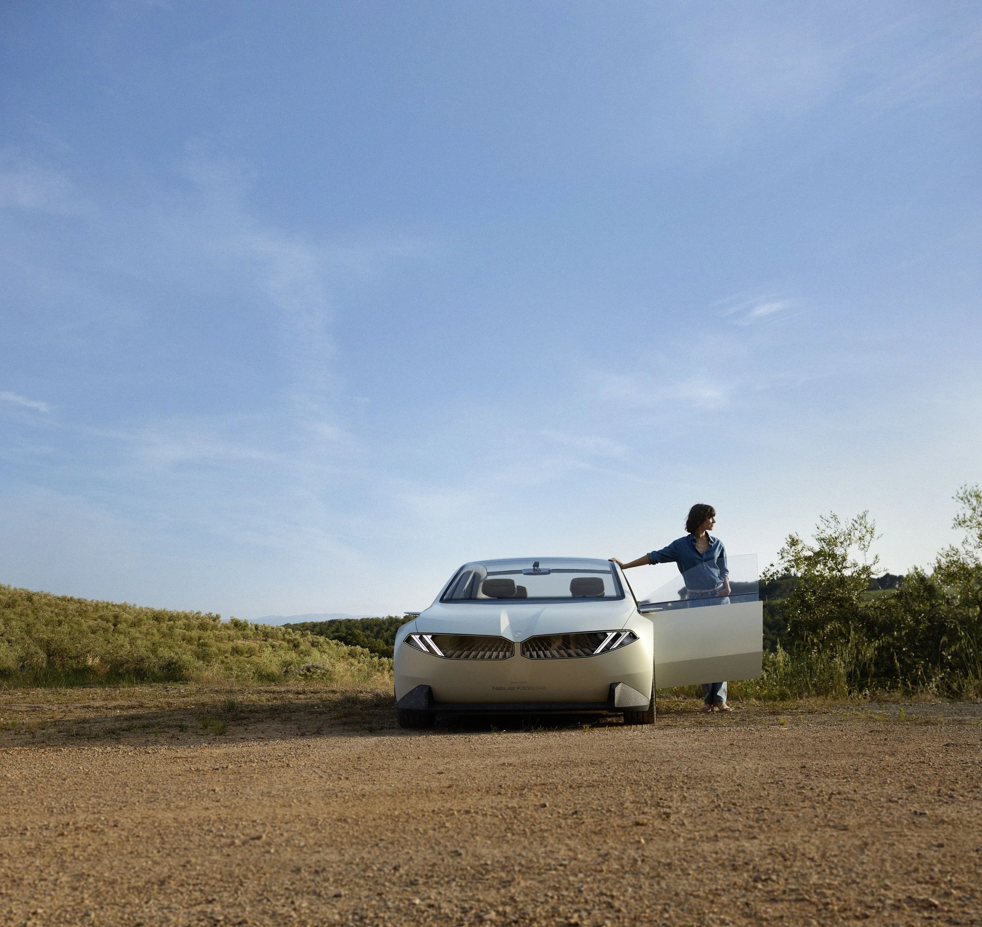 bmw neue klasse sedan concept with woman