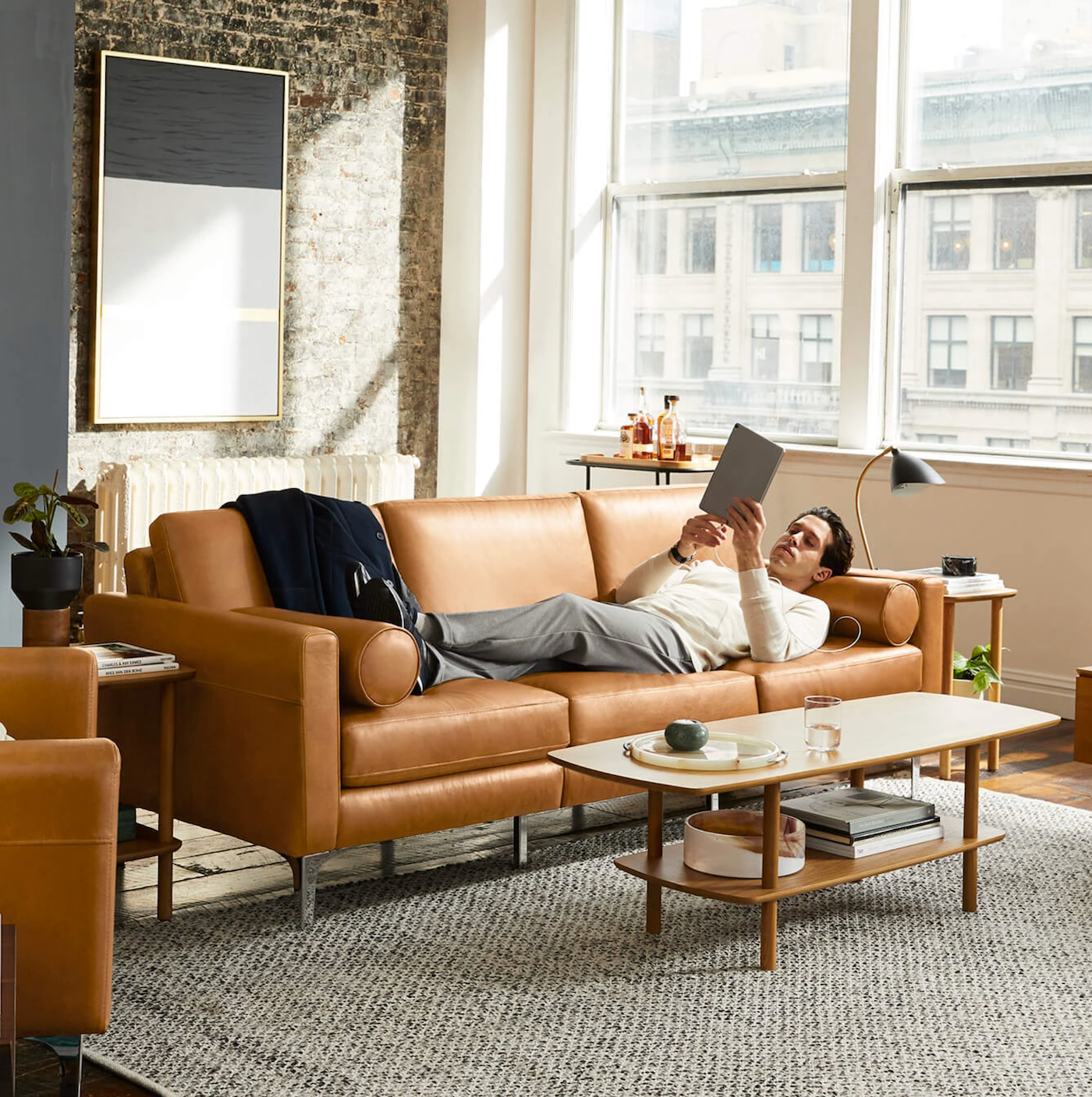 a man on a sofa reading