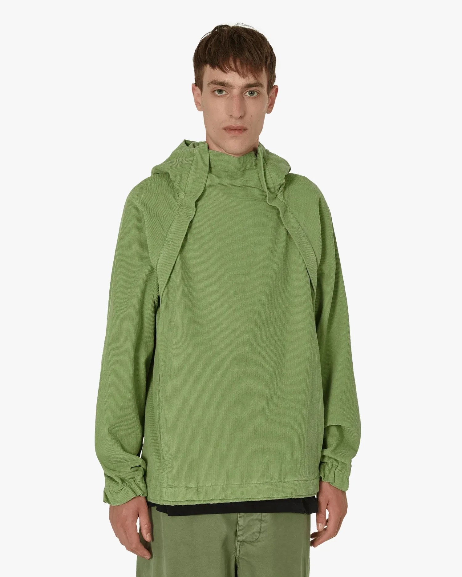 man wearing ranra klifur hooded jacket sage