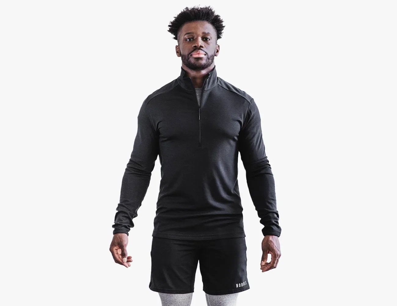 a man wearing a black sweater