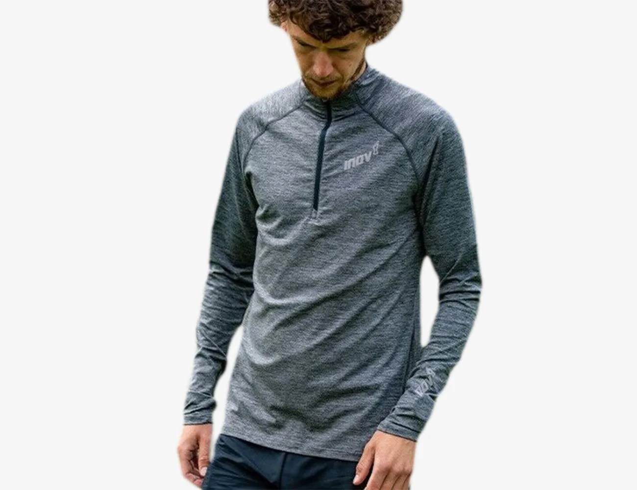 a man wearing a grey sweater