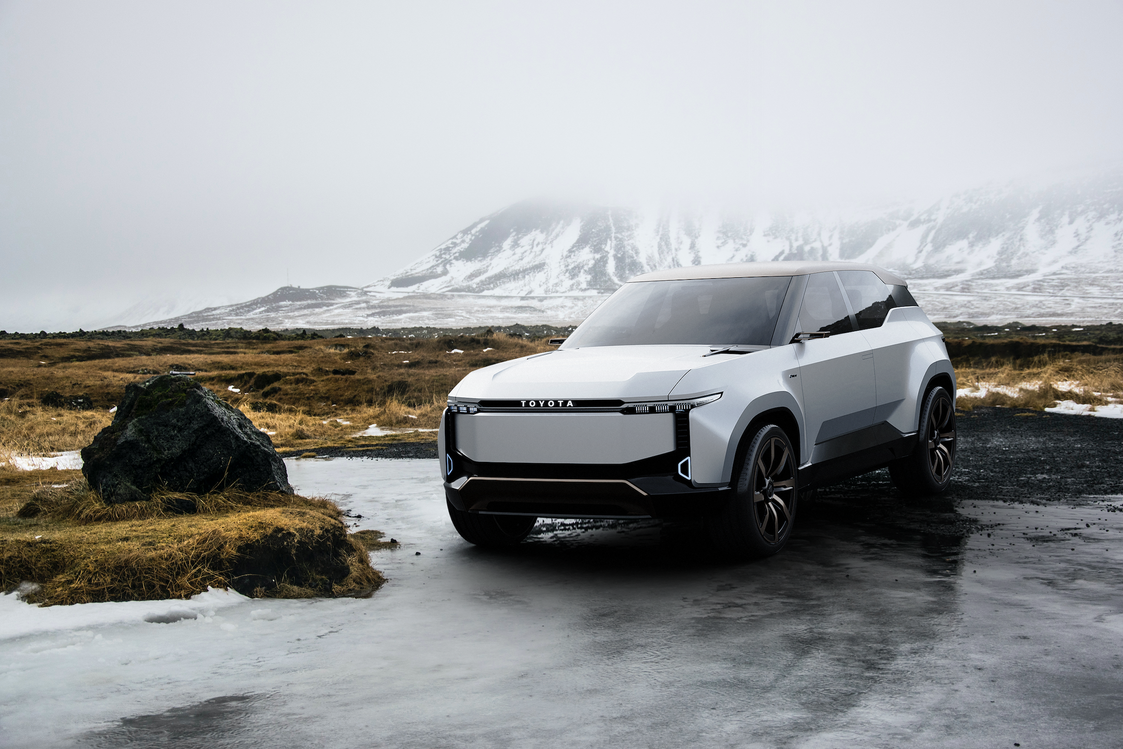 land cruiser suv concept in front of snowy mountains