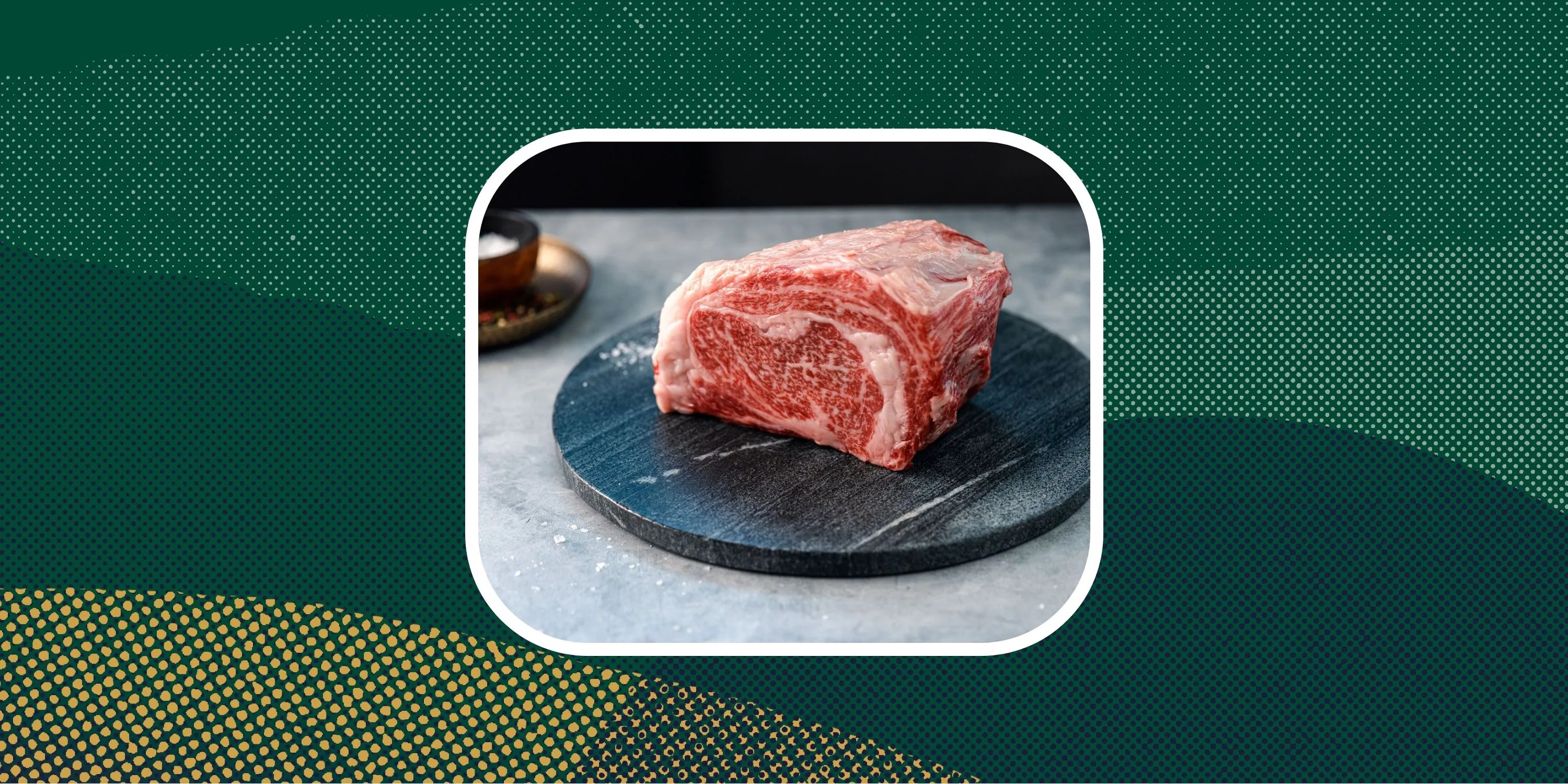 deals of note crowd cow a piece of raw wagyu on a plate next to a small bowl of salt