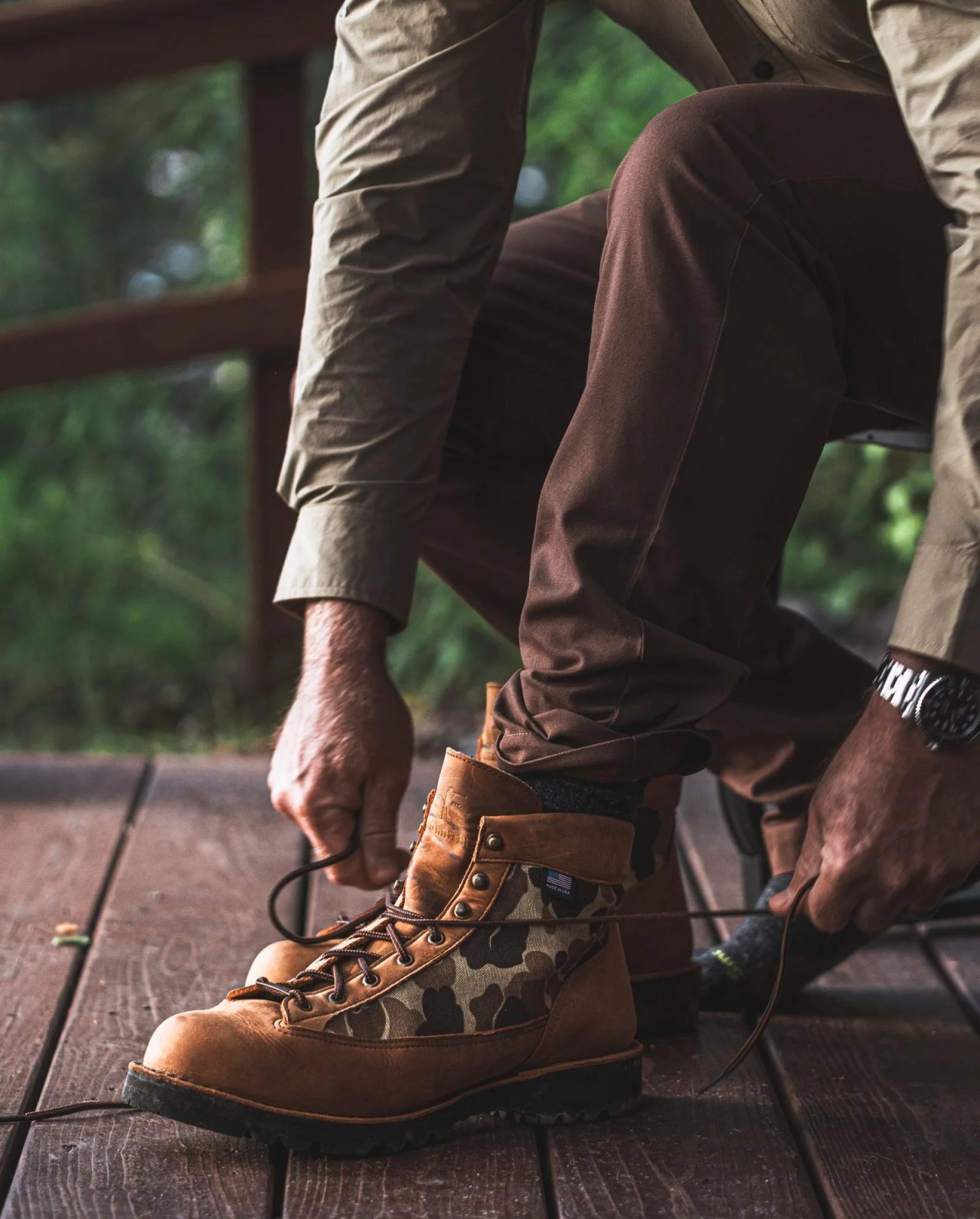 a person wearing brown ball and buck boots