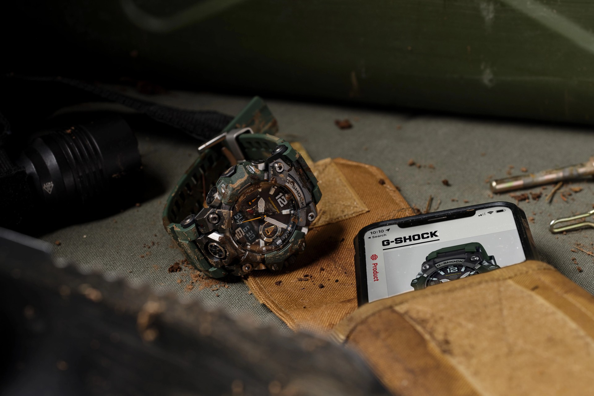 casio g shock watch next to phone