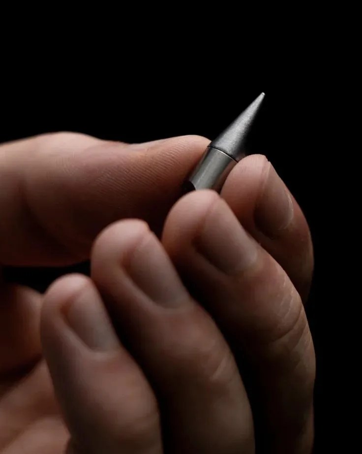 hand holding world's tiniest foreverpen