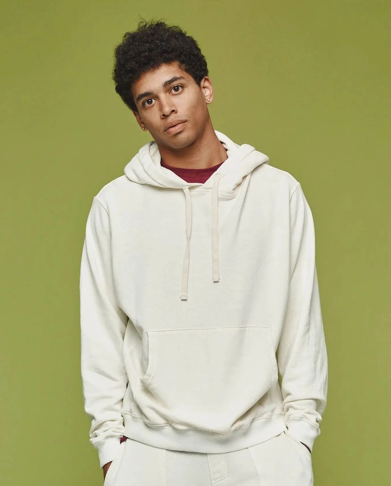 man wearing jungmaven montauk hooded sweatshirt