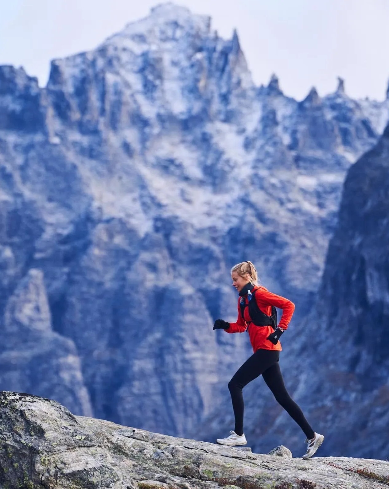 woman hiking up the mountain wearing venta gloves