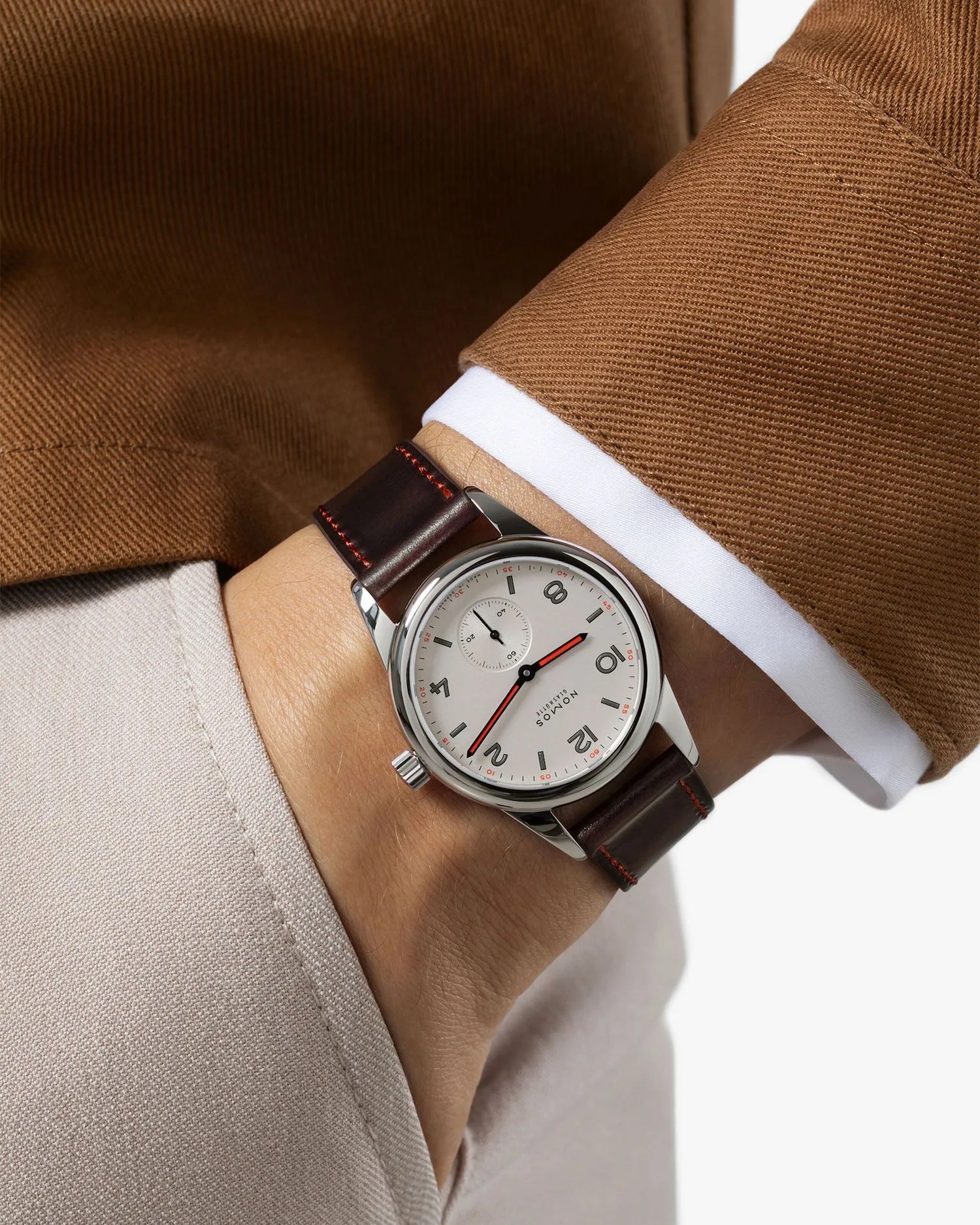 a person wearing a nomos glashutte watch