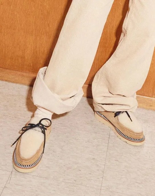 person wearing willow wallabee hazel suede stain resistant with shearling shoes