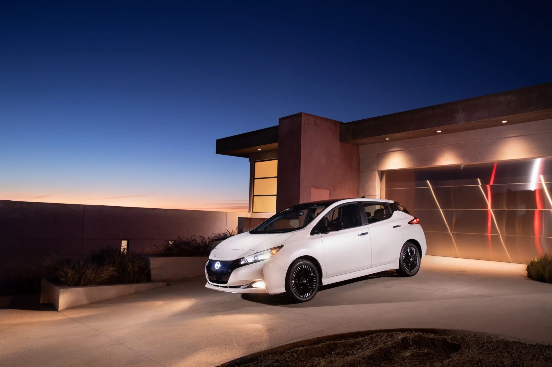 a white car parked outside a building