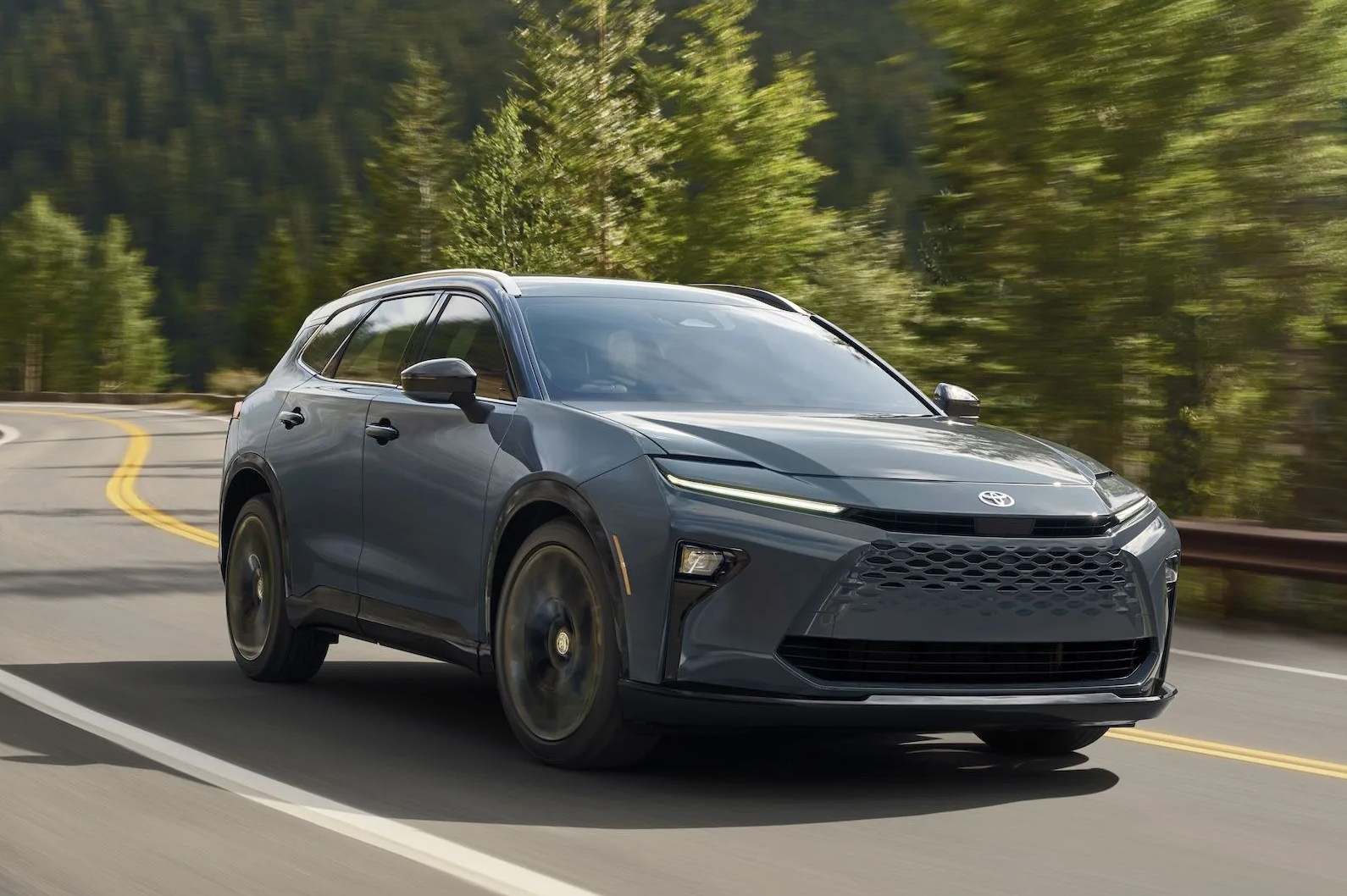 a black car driving on a road