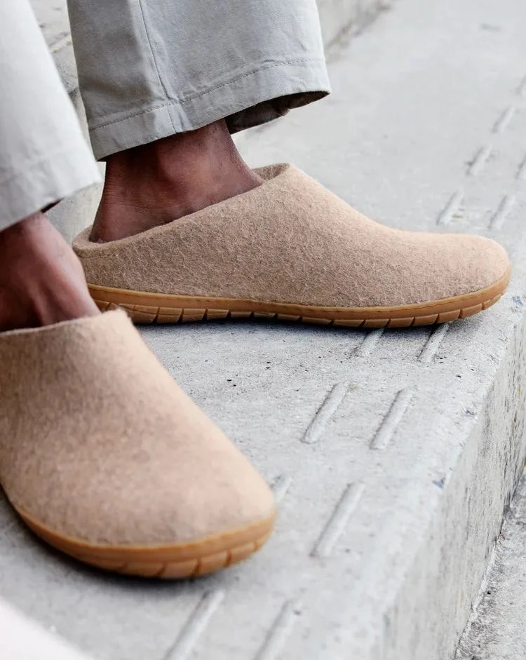 a person wearing glerups shoes