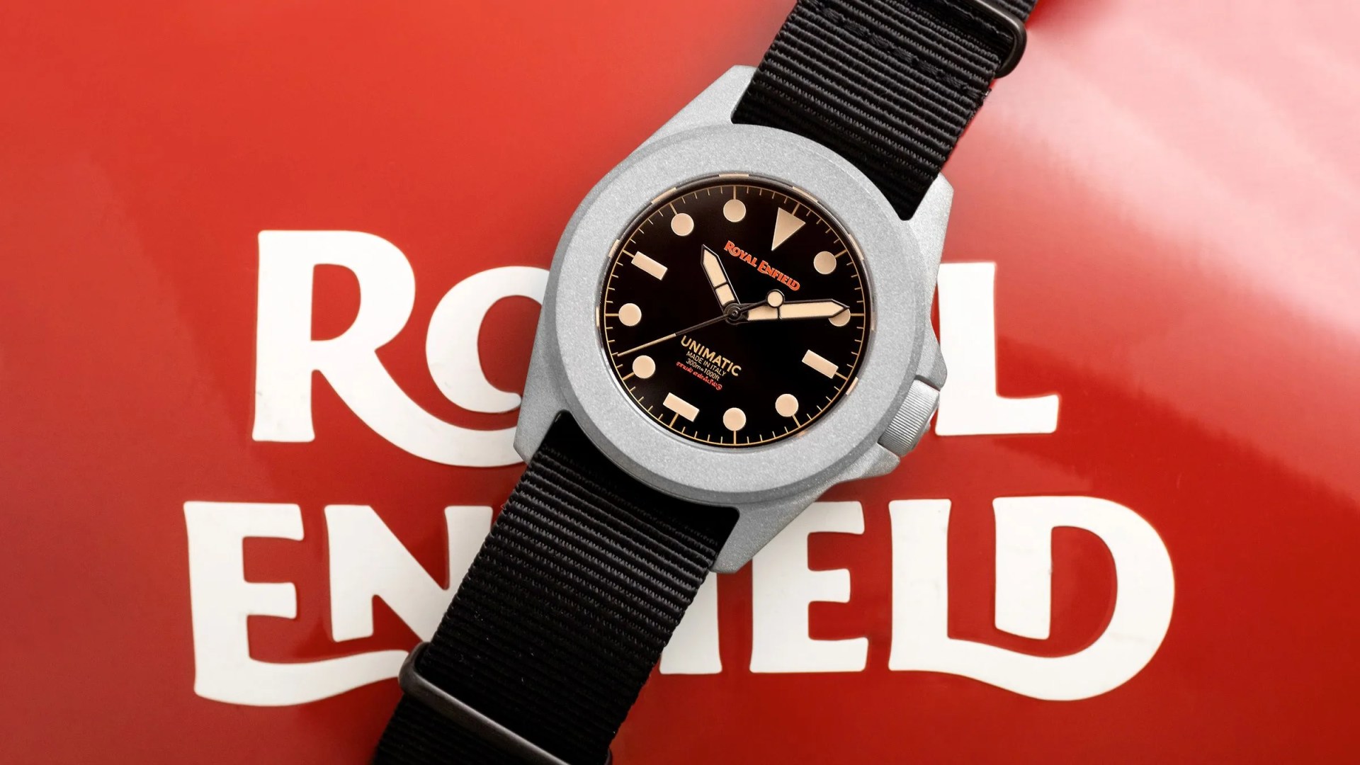 a black watch on a red background