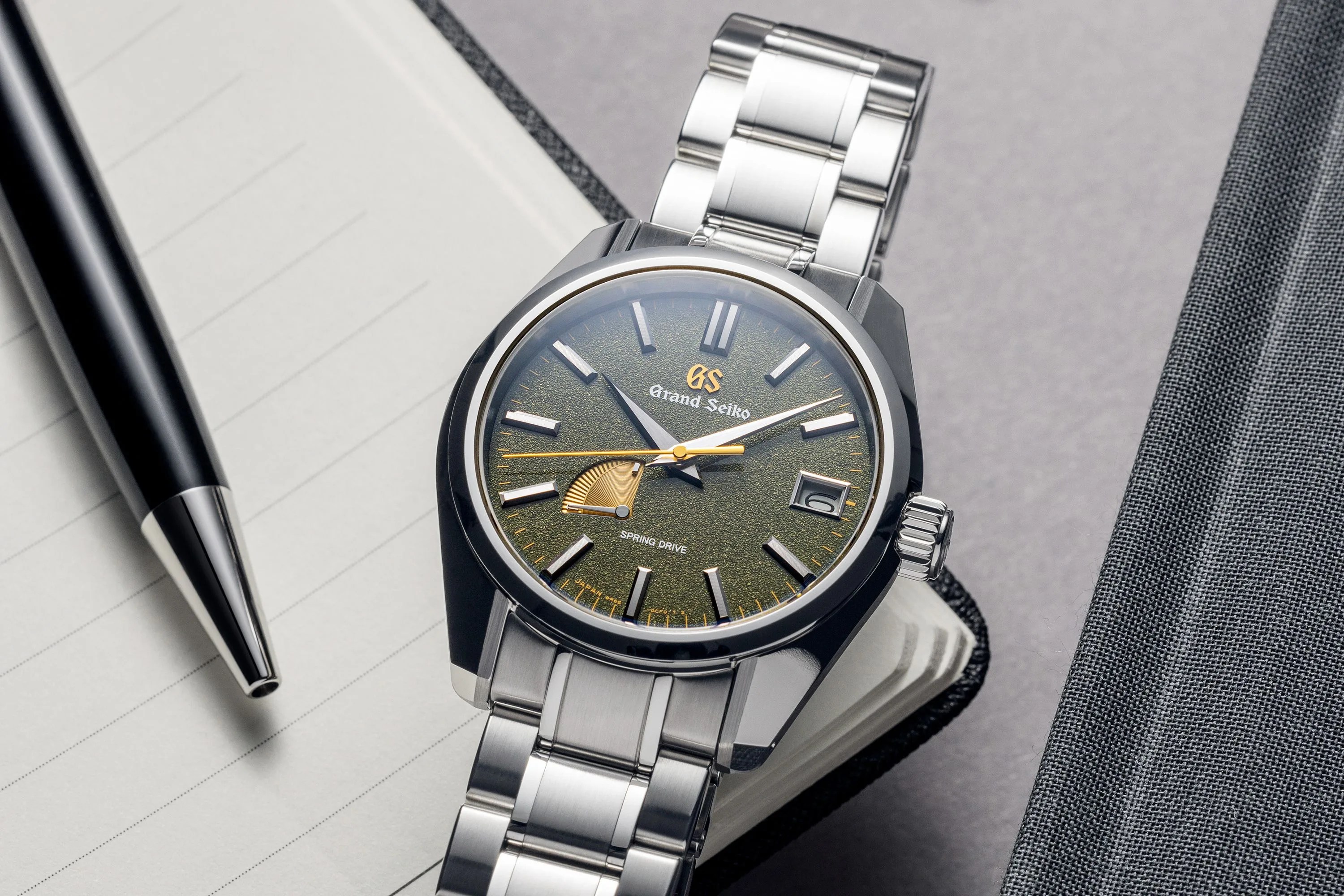 a black watch on a white surface