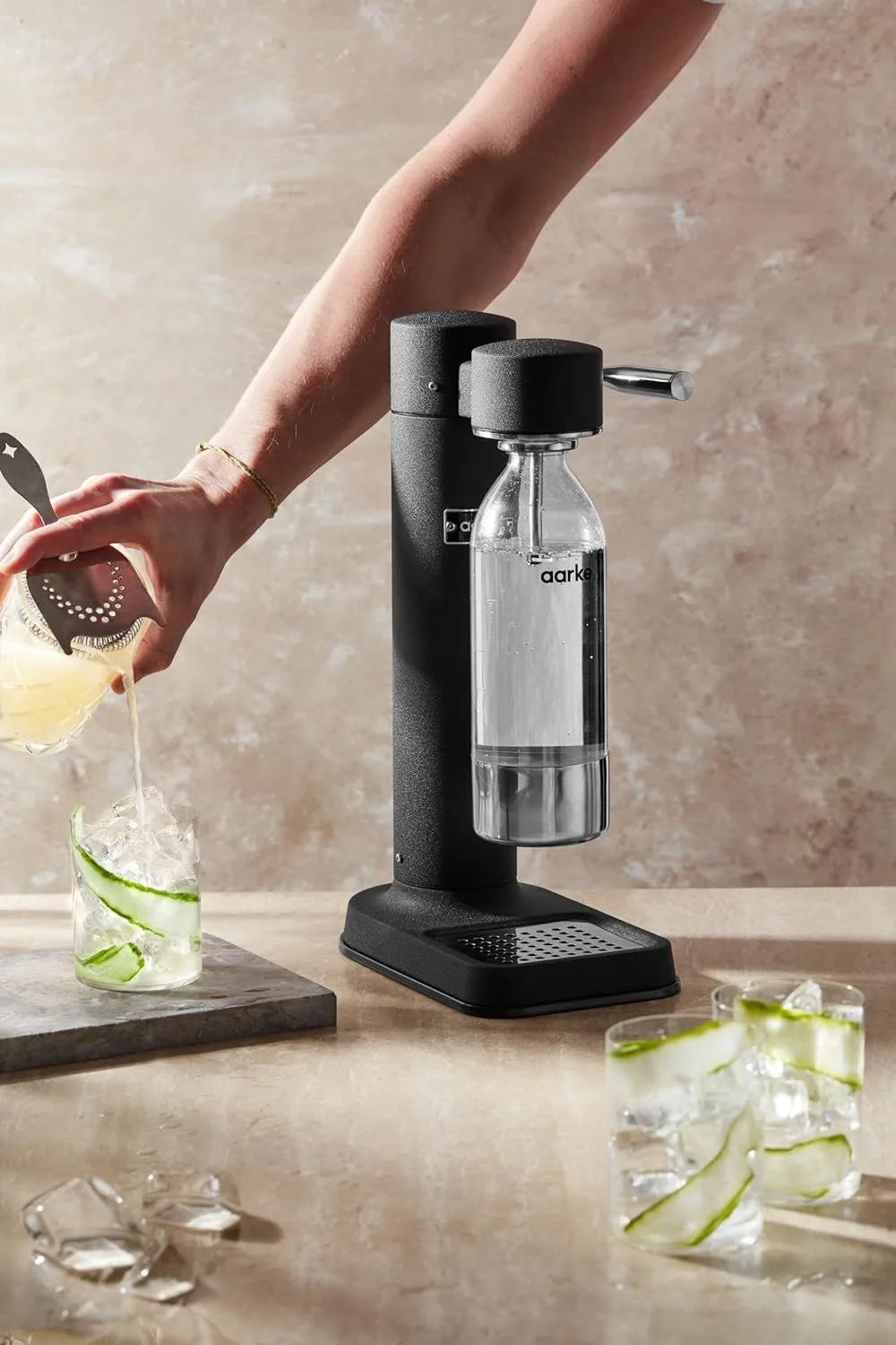 a person using a carbonator iii premium carbonator