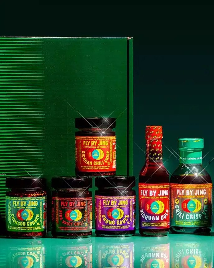 a group of fly by jing bottles
