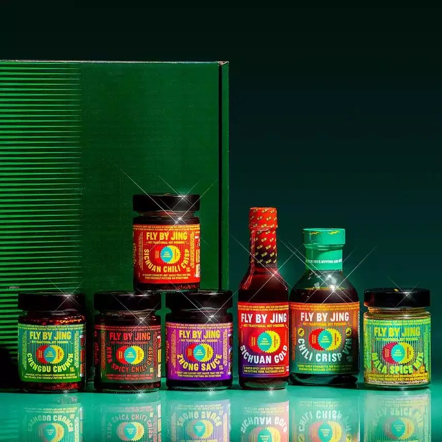 a group of fly by jing bottles