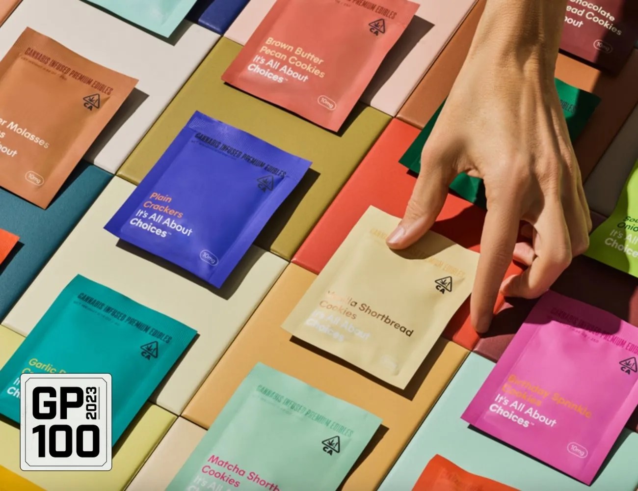 a hand grabbing a package of edibles