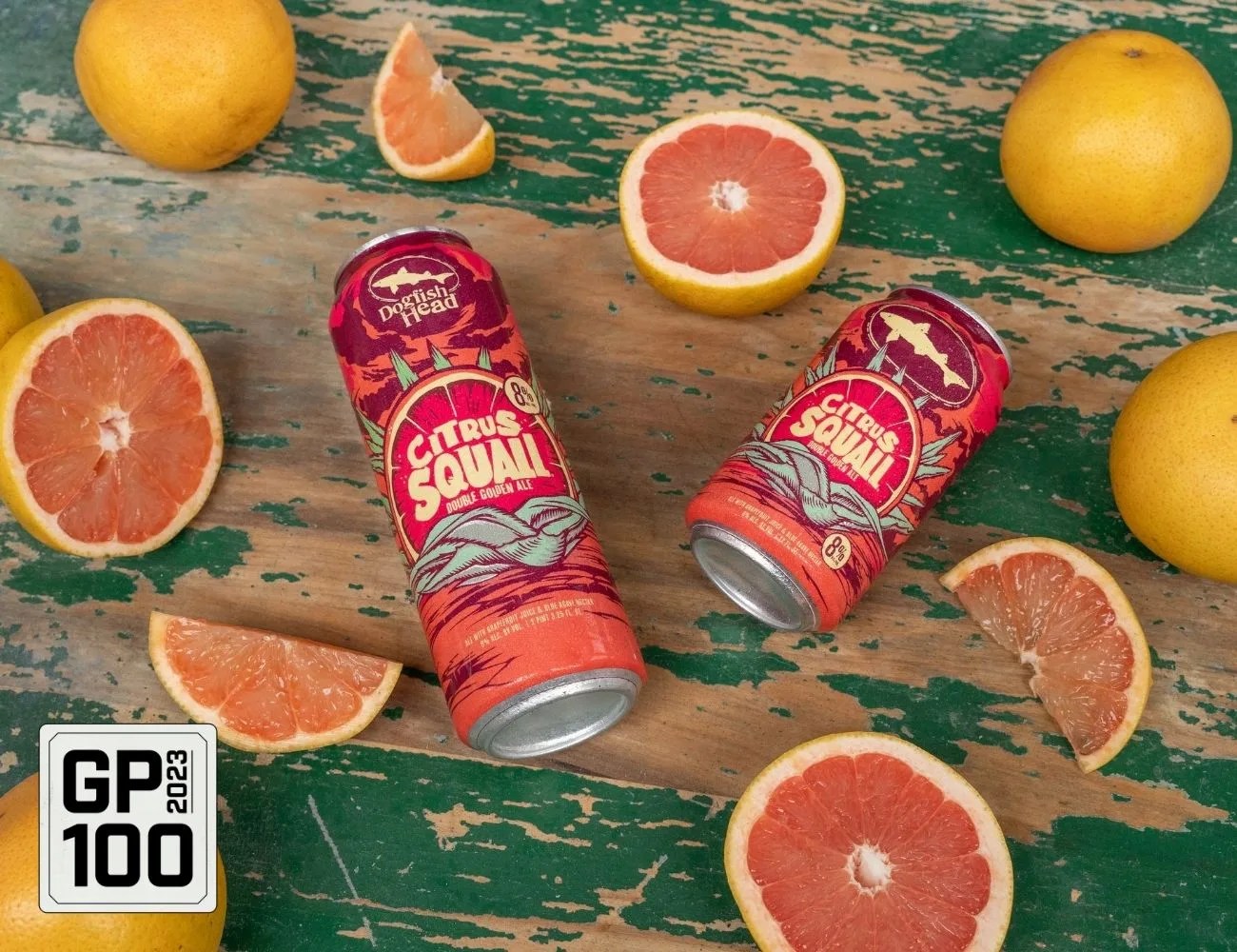 a group of oranges and a can of soda on a table