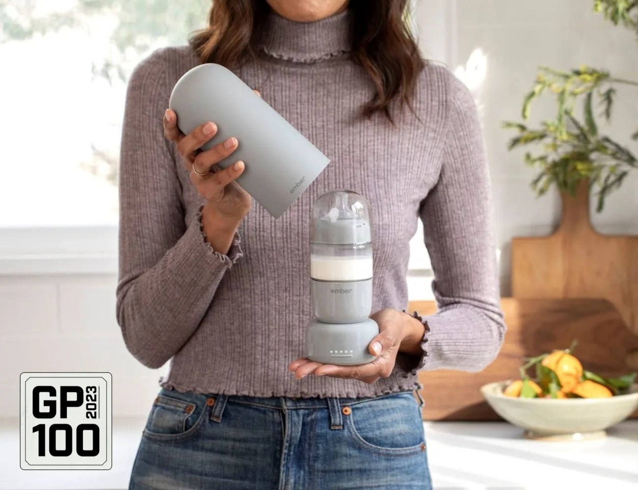 a woman holding a bottle of milk