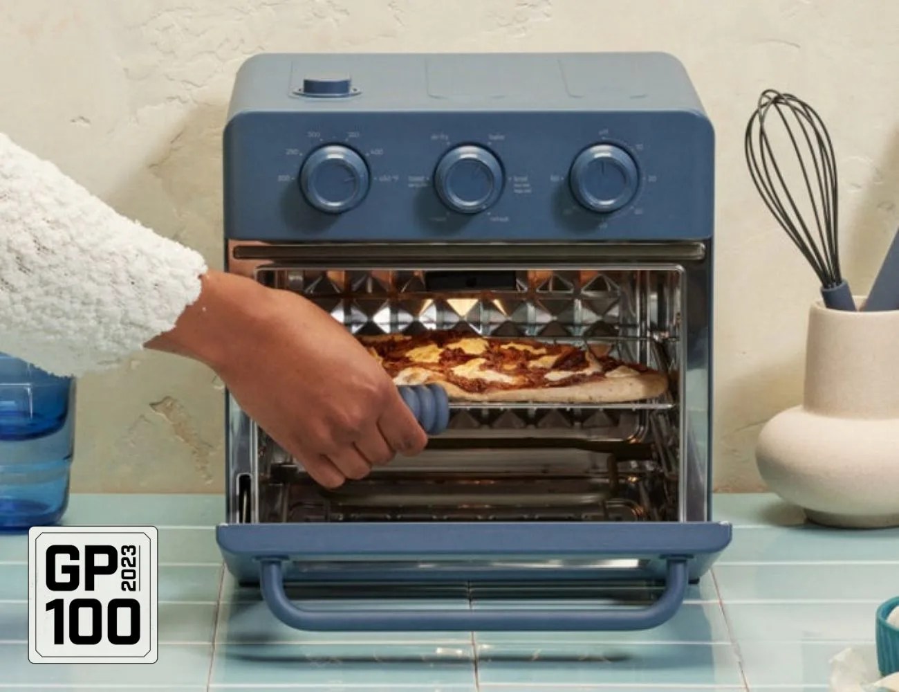 a person putting food in an oven
