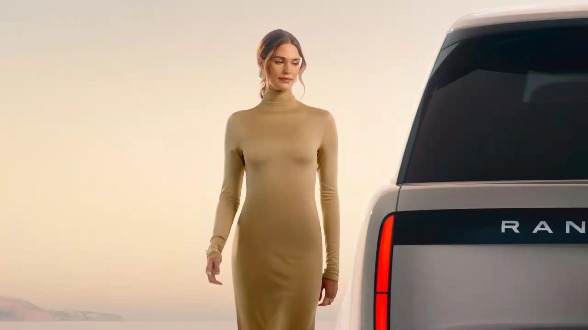 a person standing next to a car
