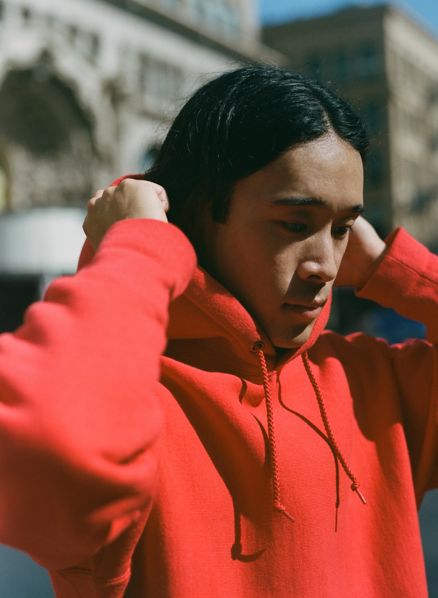 a person wearing a red hoodie
