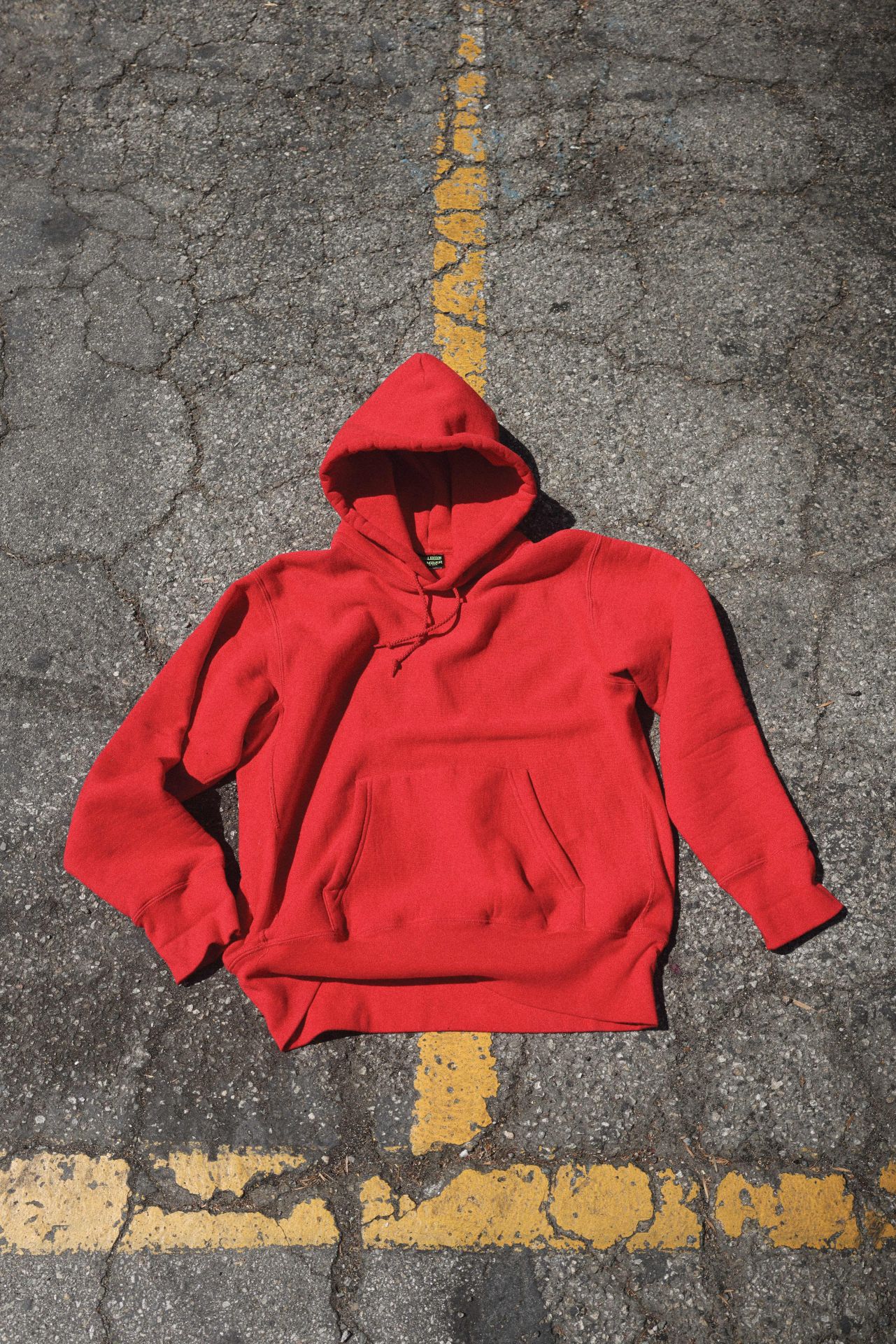a red hoodie laying on the ground