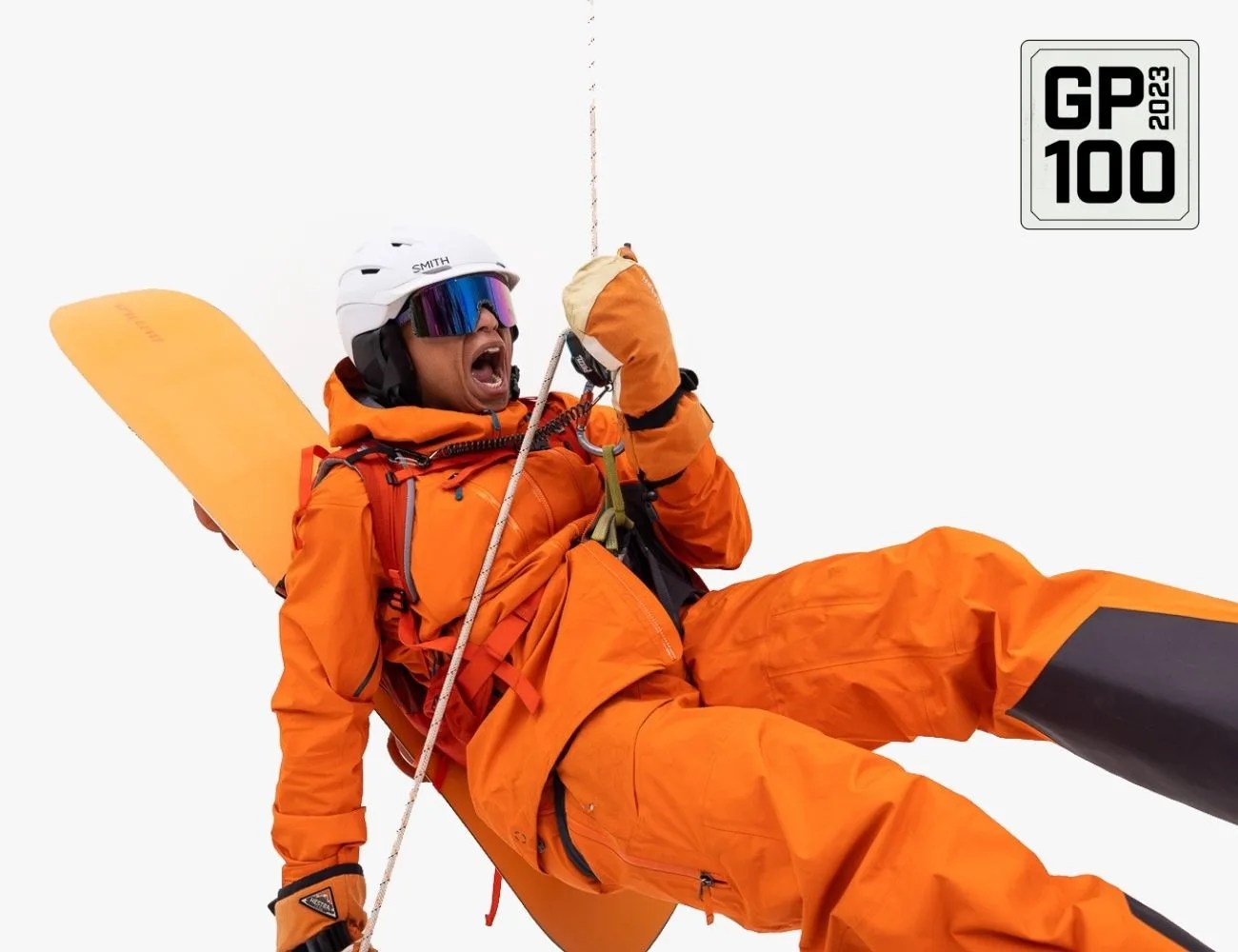 a person in orange jumpsuit holding a rope