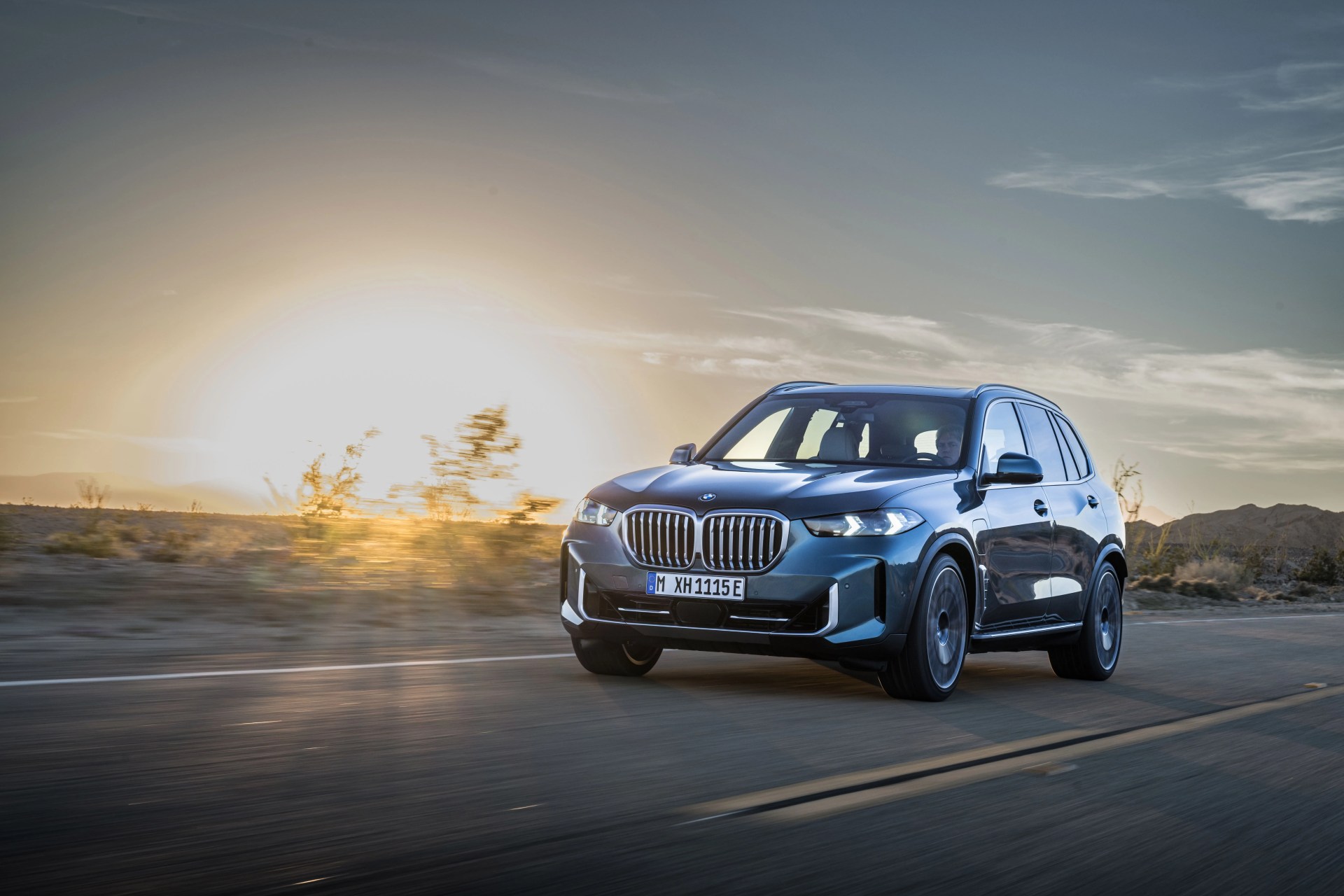 bmw x6 driving on road