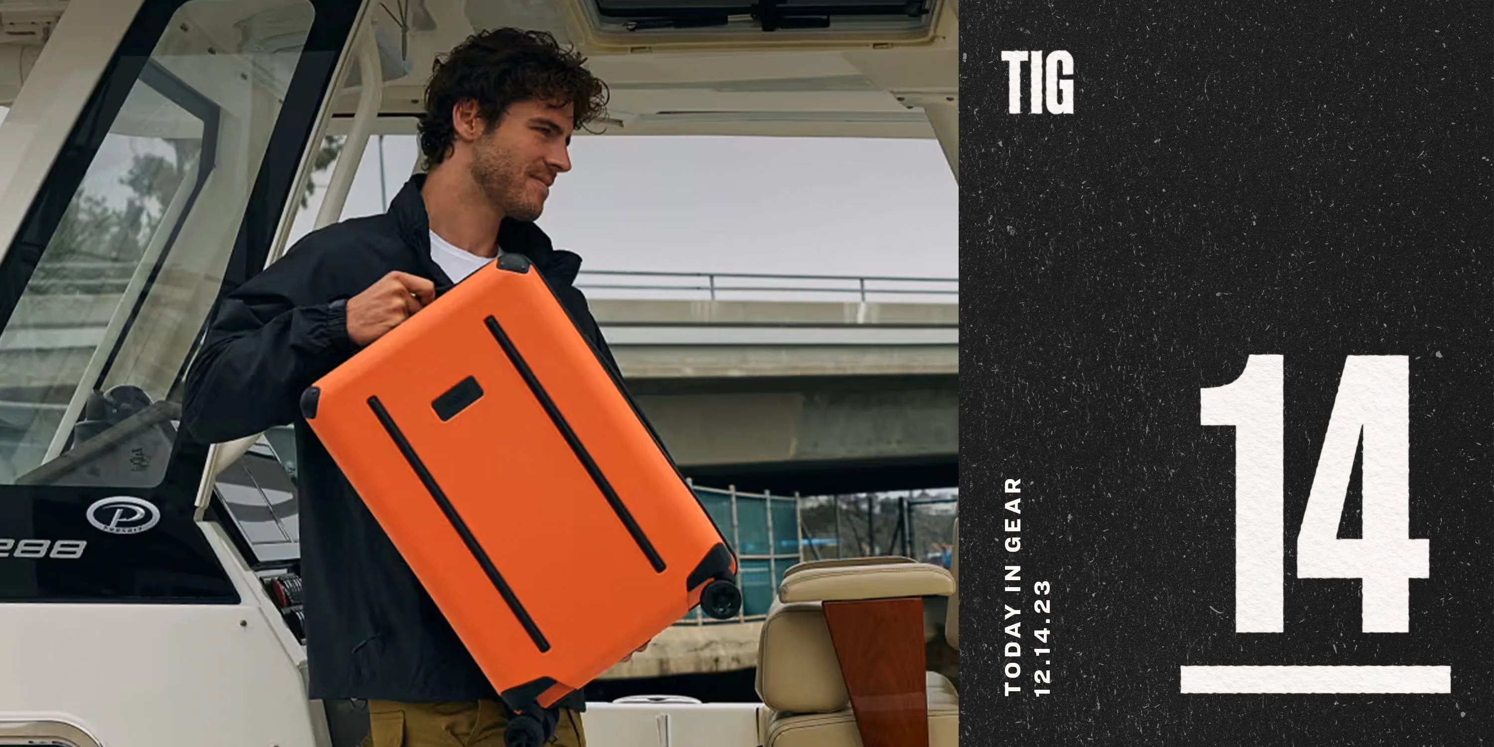 today in gear december 14 2023 a man holding a orange ridge carry on suitcase