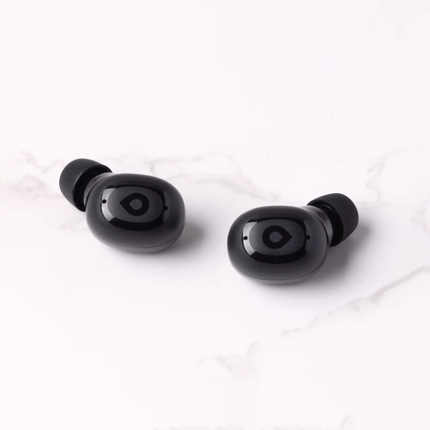 earbuds on a marble counter