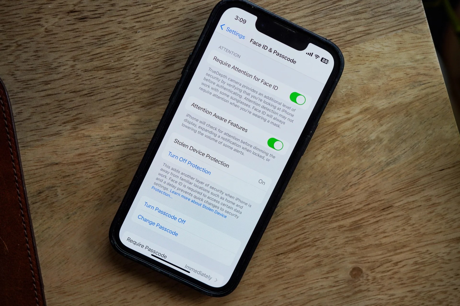 an iphone on a wooden desk
