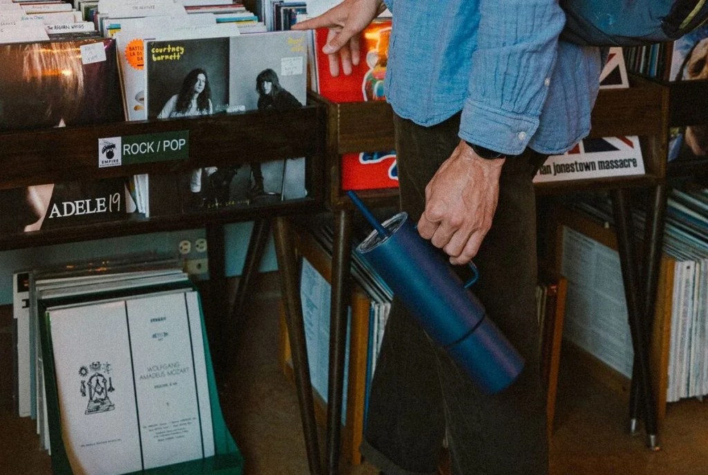 man holding miir bottle