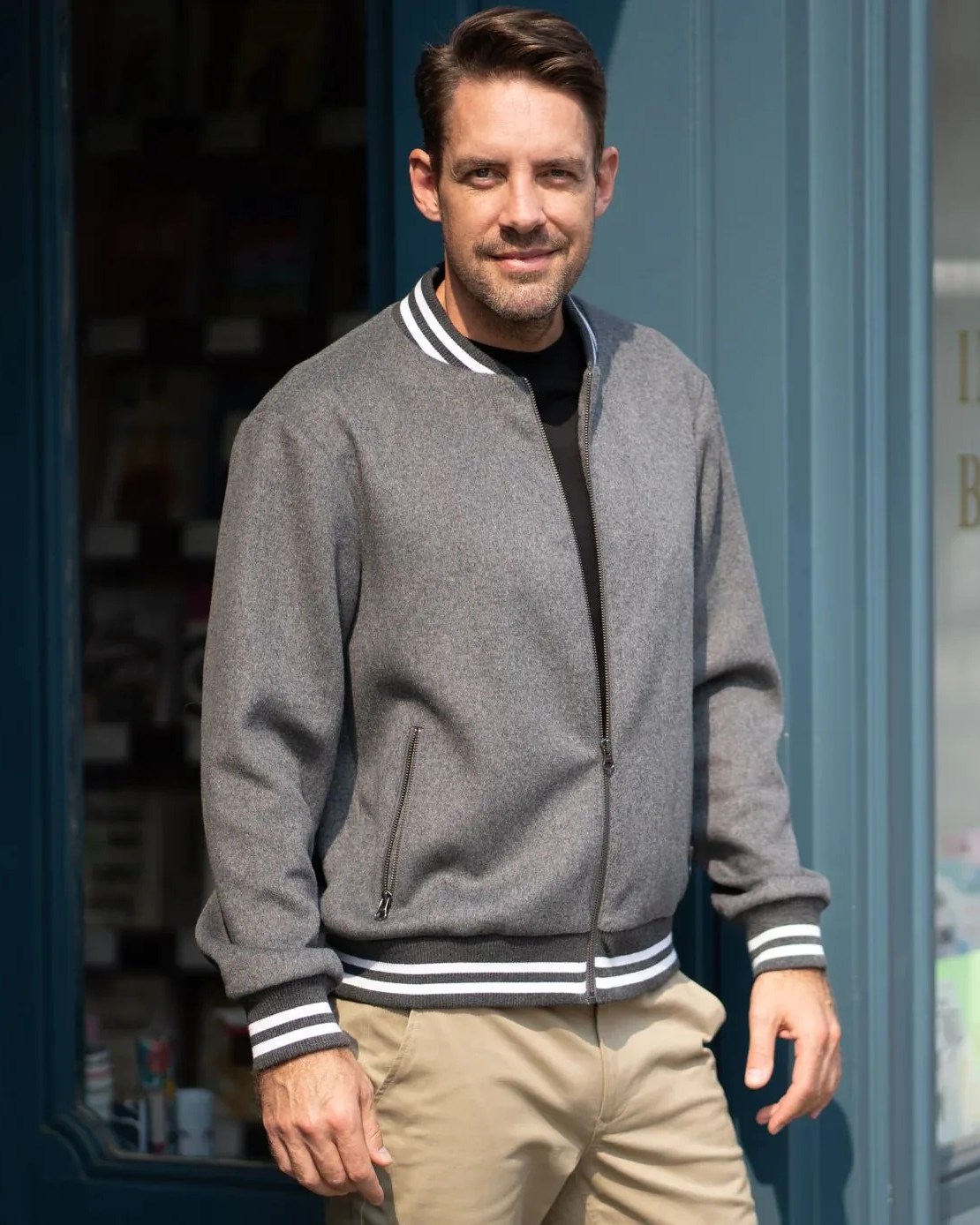 a man wearing highland duds varsity wool bomber jacket