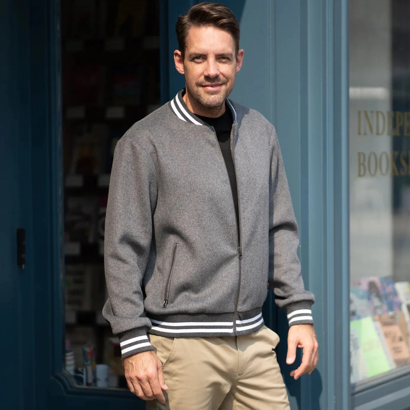 a man wearing highland duds varsity wool bomber jacket