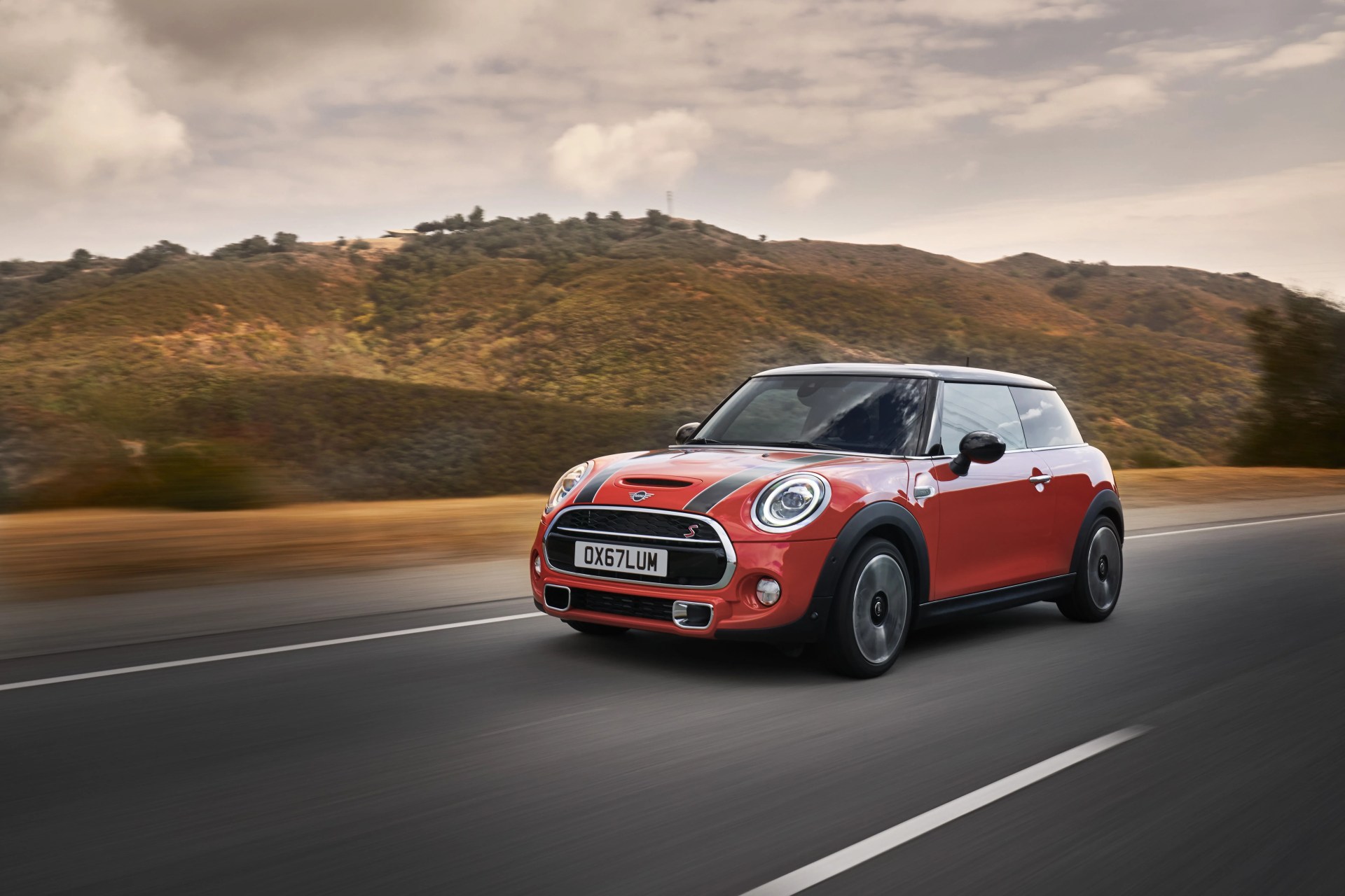 2021 mini cooper hardtop in orange on a road