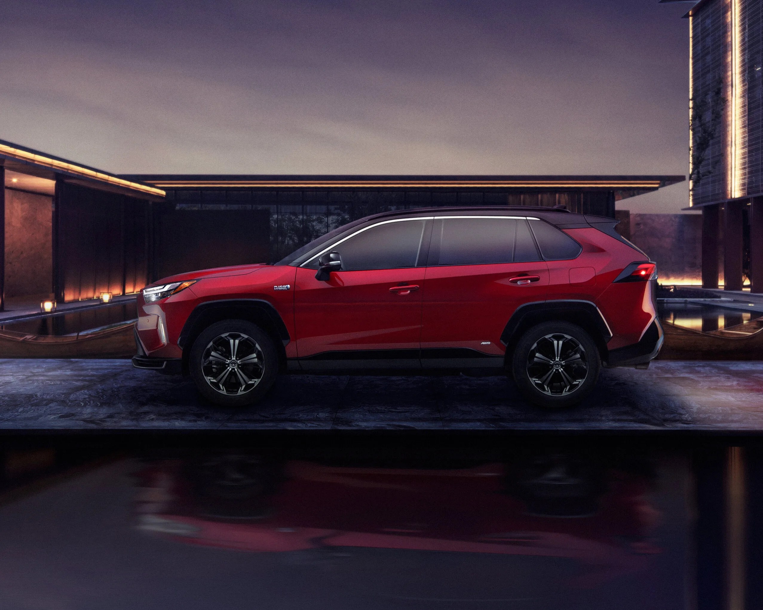 Toyota Rav4 prime parked outside a modern house