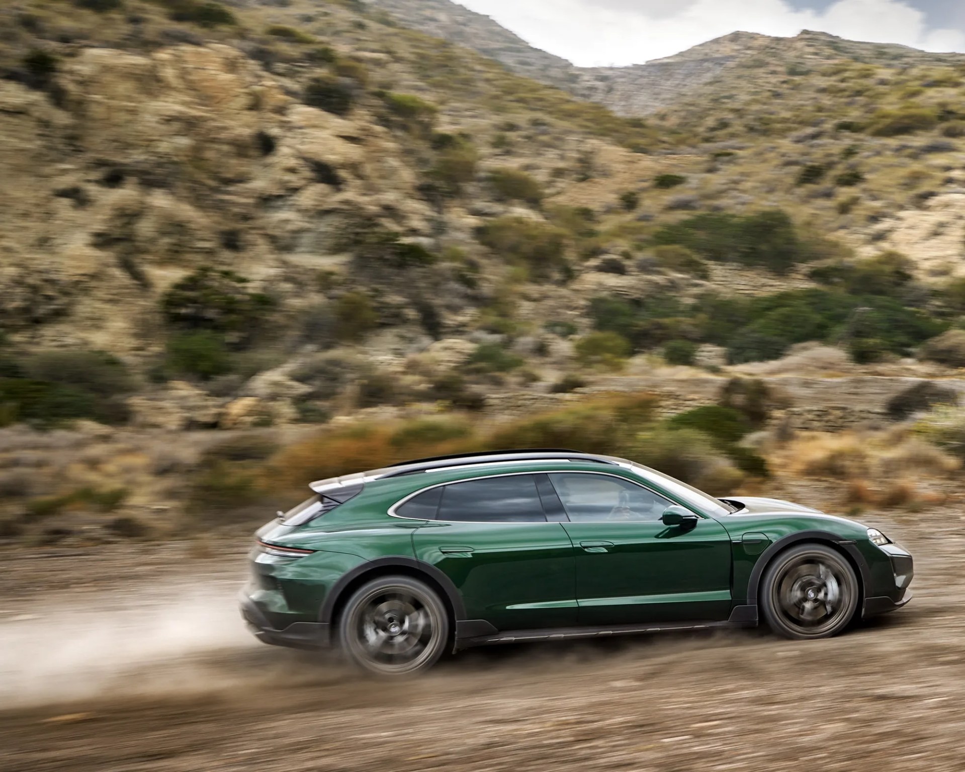 green porsche station wagon off-road