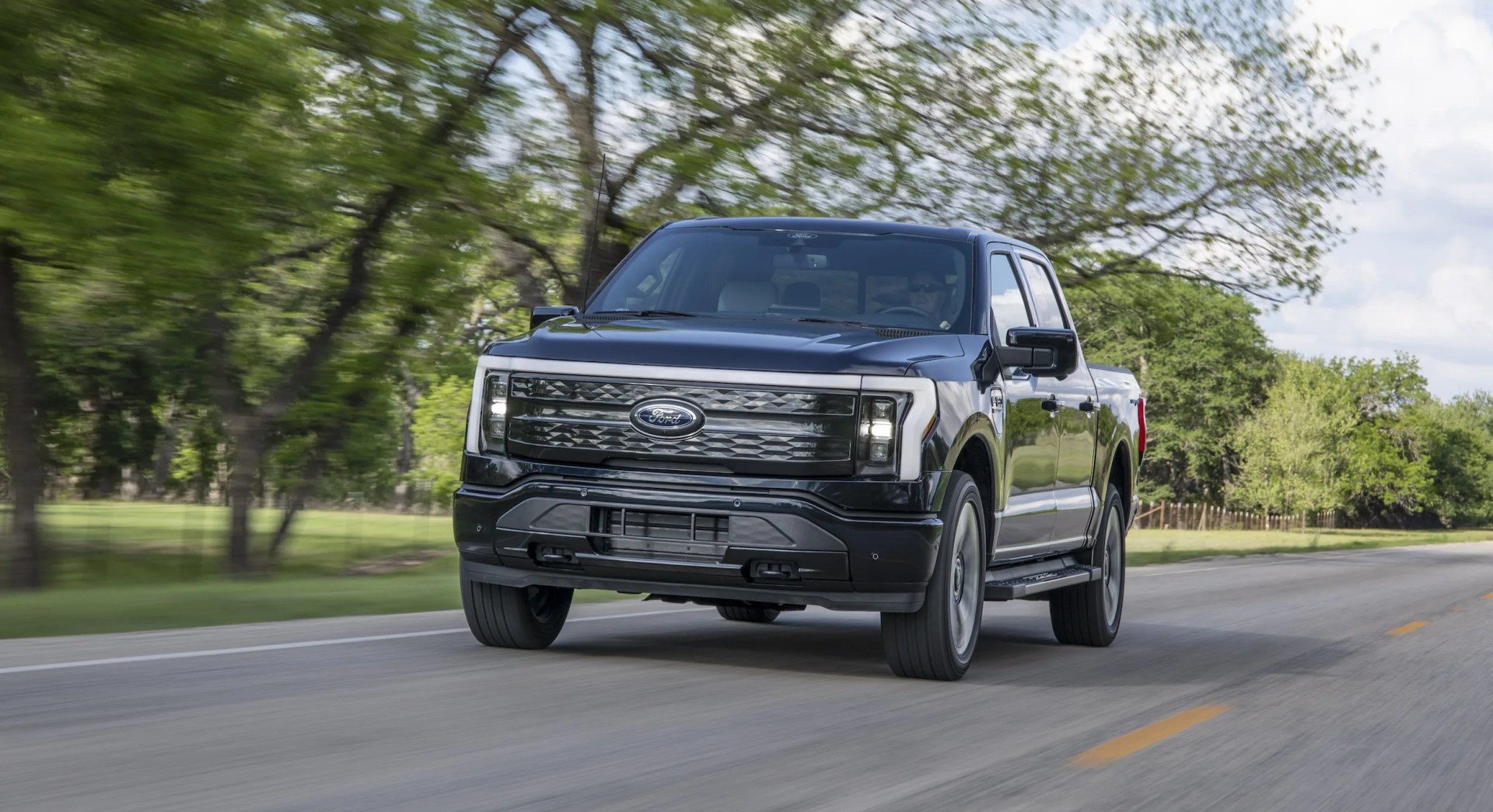 Ford F-150 Lightning driving on road