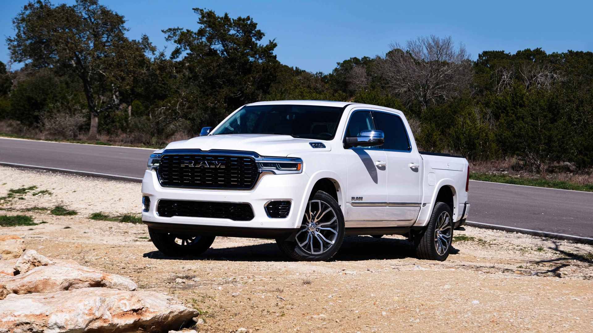 Ram 1500 parked in dirt by lake